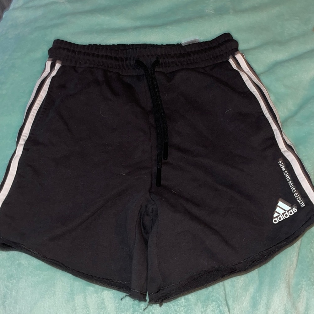 Fits a size 8-10 labeled as medium. Cute athletic Adidas shorts